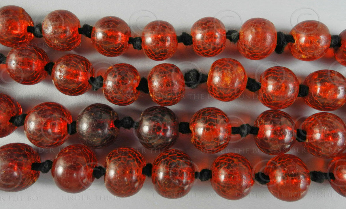 Red hot sale amber beads