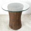 Side table H19-98. Teakwood curry pounders with glass top. India.