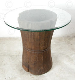 Side table H19-98. Teakwood curry pounders with glass top. India.