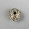 Mottled stone bead 22SH1E. Oxus civilization, Central Asia. Second or first millenium BCE.