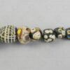 Group of nine glass paste beads 22SH9. Found in Afghanistan. Islamic period, circa 9th-12th century.