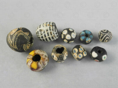 Group of nine glass paste beads 22SH9. Found in Afghanistan. Islamic period, circa 9th-12th century.